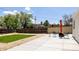 Backyard patio with a fireplace, chairs, and a grassy area at 1010 N Jasmine St, Denver, CO 80220