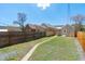 Backyard featuring a lush lawn and a pathway leading to the shed at 4636 Leaf Ct, Denver, CO 80216