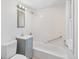 Updated bathroom features new fixtures, a shower-tub combination, and an updated vanity at 4636 Leaf Ct, Denver, CO 80216