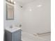 Updated bathroom features new fixtures, a shower-tub combination, and an updated vanity at 4636 Leaf Ct, Denver, CO 80216
