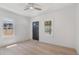 Bright bedroom featuring light wood floors, white walls, ceiling fan and natural light at 4636 Leaf Ct, Denver, CO 80216