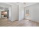 Bright bedroom with light wood floors, white walls, window, and ceiling fan at 4636 Leaf Ct, Denver, CO 80216
