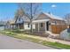 Street view displaying the home exterior and small front yard, complemented by mature tree at 4636 Leaf Ct, Denver, CO 80216