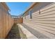 View of the side of the house and a partial view of the fence at 4636 Leaf Ct, Denver, CO 80216