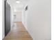 Bright hallway features an adjacent kitchen and leads to bedrooms and living spaces at 4636 Leaf Ct, Denver, CO 80216
