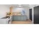 Updated kitchen has butcher block countertops, stainless steel sink, stainless steel appliances, and access to an updated bathroom at 4636 Leaf Ct, Denver, CO 80216