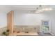 Charming kitchen featuring modern countertops and a sink with natural light from the window at 4636 Leaf Ct, Denver, CO 80216