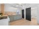 Beautiful new kitchen with butcher block countertops, stainless steel sink, and access to an updated bathroom at 4636 Leaf Ct, Denver, CO 80216