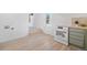 Bright updated kitchen features new appliances and flows into a separate room by way of a short set of stairs at 4636 Leaf Ct, Denver, CO 80216