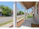 Cozy covered front porch features classic white pillars, a mat, and a relaxing vantage point with neighborhood views at 4636 Leaf Ct, Denver, CO 80216