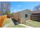 View of the backyard shed and partial view of the lawn and fence at 4636 Leaf Ct, Denver, CO 80216