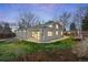 Large backyard with newly laid lawn and planting beds wraps around the home at 3206 S Clayton St, Denver, CO 80210