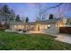 Spacious backyard with patio, fire pit, comfortable seating, and plenty of room to entertain at 3206 S Clayton St, Denver, CO 80210