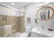 Bright bathroom with sleek vanity, walk-in shower, and modern fixtures at 3206 S Clayton St, Denver, CO 80210