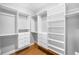 Walk-in closet with custom built-in shelving and drawers for storage and organization solutions at 3206 S Clayton St, Denver, CO 80210