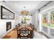 Dining room with a fireplace and large glass doors leading to the outdoor patio at 3206 S Clayton St, Denver, CO 80210