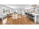 Bright living room with hardwood floors, fireplace, and large windows for natural light at 3206 S Clayton St, Denver, CO 80210