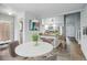 Bright dining area with views into the kitchen, a modern table, and stylish decor at 4961 W 98Th Ave, Westminster, CO 80031