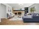 Spacious living room featuring a brick fireplace, ample seating, and stylish decor at 4961 W 98Th Ave, Westminster, CO 80031