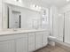 Bathroom features a double vanity, glass enclosed shower, and large mirror at 24719 E 39Th Ave, Aurora, CO 80019