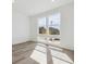 Bright room with wood floors and large windows offering ample natural light at 24719 E 39Th Ave, Aurora, CO 80019