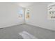 Bedroom featuring plush carpet, neutral walls, and abundant natural light from two windows at 24719 E 39Th Ave, Aurora, CO 80019