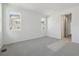 Bedroom featuring plush carpet, neutral walls, and natural light from two windows at 24719 E 39Th Ave, Aurora, CO 80019