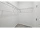 Walk-in closet with metal shelving and carpeted floor provides ample storage space at 24719 E 39Th Ave, Aurora, CO 80019