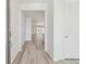 Bright entryway with wood flooring flowing into a spacious open-concept living area at 24719 E 39Th Ave, Aurora, CO 80019