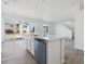 Open-concept kitchen boasts a center island with a sink and dishwasher, and a sliding glass door at 24719 E 39Th Ave, Aurora, CO 80019