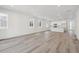 Spacious living room featuring multiple windows for natural light, and hard surface floors at 24719 E 39Th Ave, Aurora, CO 80019