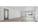 Bright living room with wood flooring, recessed lights, and access to the backyard through sliding glass doors at 24719 E 39Th Ave, Aurora, CO 80019