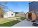 Inviting backyard with a modern sauna, well-manicured lawn, and a detached structure at 3938 Kalamath St, Denver, CO 80211