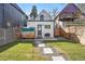 Backyard with a wood-burning sauna, detached unit, modern design, and well-kept lawn at 3938 Kalamath St, Denver, CO 80211