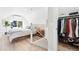 Bright bedroom featuring a view of the staircase and a closet, accentuated with modern decor elements at 3938 Kalamath St, Denver, CO 80211