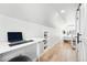 Bright bedroom featuring an adjustable desk, hardwood floors, and a cozy, sunlit sleeping area at 3938 Kalamath St, Denver, CO 80211