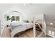 Bright bedroom with a cozy bed by a large window, offering a relaxing retreat at 3938 Kalamath St, Denver, CO 80211