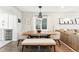 Dining area with a large wooden table and comfortable seating, perfect for Gathering meals at 3938 Kalamath St, Denver, CO 80211