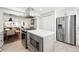 Open concept kitchen with stainless steel appliances and a seamless flow to the adjacent living spaces at 3938 Kalamath St, Denver, CO 80211