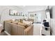 Well-lit living area with a large sectional, providing a warm and inviting space at 3938 Kalamath St, Denver, CO 80211
