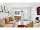 Cozy living room with natural light and stylish decor featuring storage and a view outside at 3938 Kalamath St, Denver, CO 80211