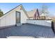 Spacious roof deck with stylish tile flooring, offering a private outdoor area next to upper level living at 3938 Kalamath St, Denver, CO 80211