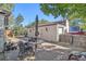 Backyard with a garage, patio, and shade umbrella providing space for outdoor activities and storage at 3790 W 54Th Ave, Denver, CO 80221