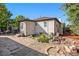 Backyard with a pond, a stone patio, and a wooden fence creating an outdoor area ideal for leisure and privacy at 3790 W 54Th Ave, Denver, CO 80221