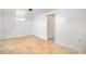 Basement room with parquet floors and white walls, and doorway, suitable for various uses at 3790 W 54Th Ave, Denver, CO 80221