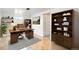 Home office features built-in shelving, desk, and ample natural light for a productive workspace at 3790 W 54Th Ave, Denver, CO 80221