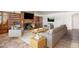 Staged living room featuring a brick fireplace, built-in shelving, and contemporary furniture at 3790 W 54Th Ave, Denver, CO 80221