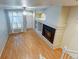 Living room with hardwood floor and fireplace at 9861 E Carolina Pl, Aurora, CO 80247