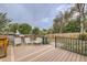 Inviting deck with black metal railing and comfortable seating, offering a relaxing outdoor space with nice backyard views at 5241 E 111 Th Ct, Thornton, CO 80233