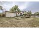 Exterior backyard view displaying wooden patio and deck, and the home's siding exterior at 5241 E 111Th Ct, Thornton, CO 80233